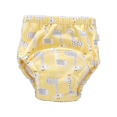 Giraffes print: pale yellow training underwear with white giraffes